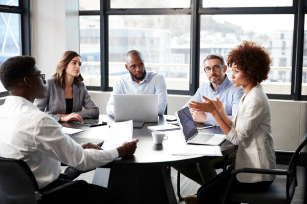 People collaborating in a meeting to signify Aggregators signing up for program.